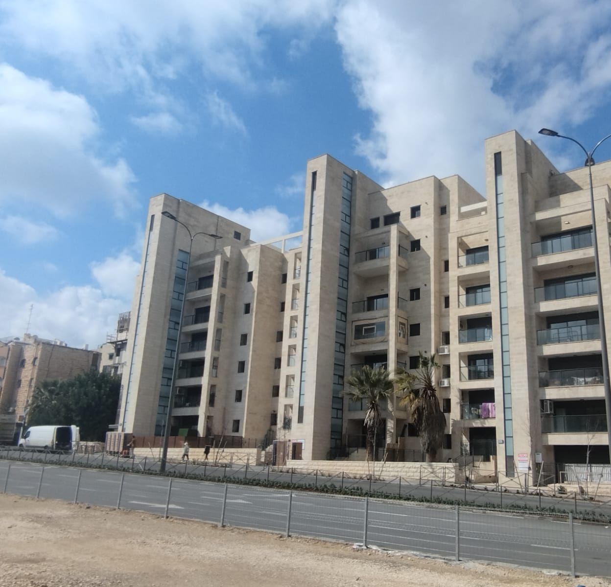 A Jerusalem stone apartment building with balconies